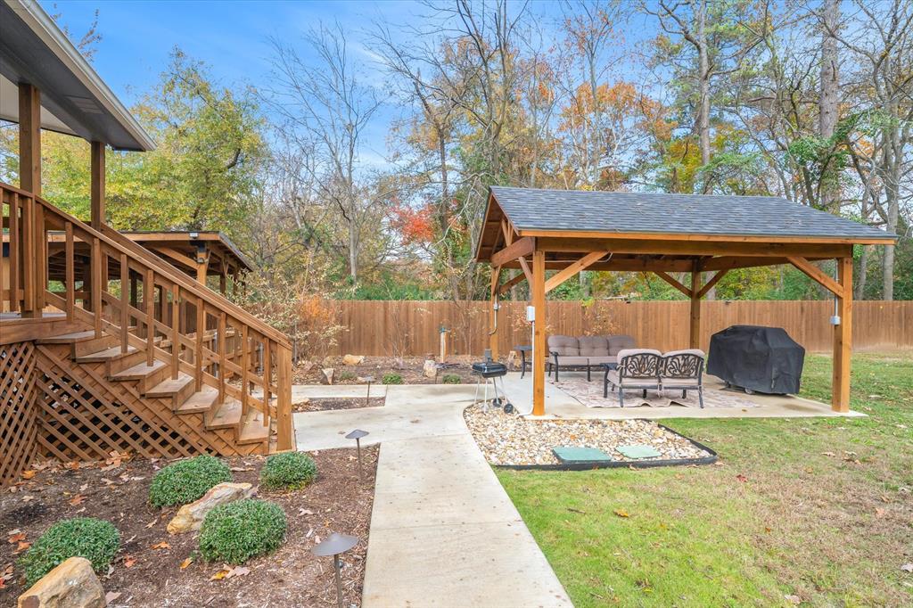 2422 Old Omen Road Tyler, TX 75701 - Photo 34 of 39 a view of house with backyard porch and sitting area