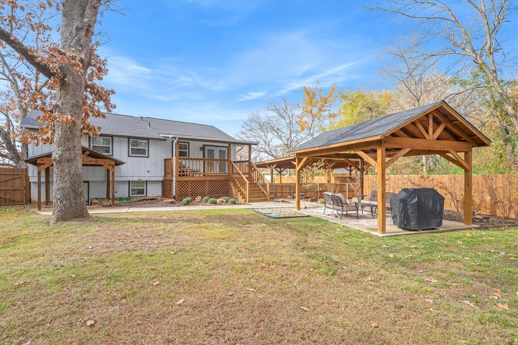 2422 Old Omen Road Tyler, TX 75701 - Photo 37 of 39 a view of a house with a yard and a garage