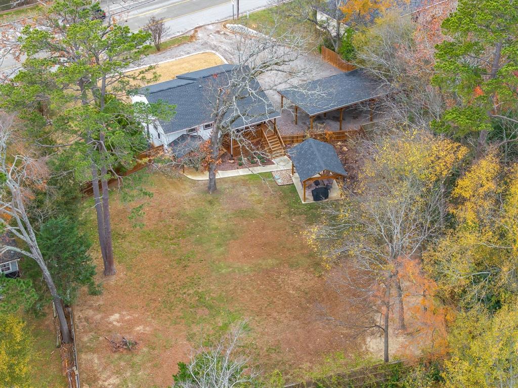 2422 Old Omen Road Tyler, TX 75701 - Photo 6 of 39 a picture of a tree in front of a house