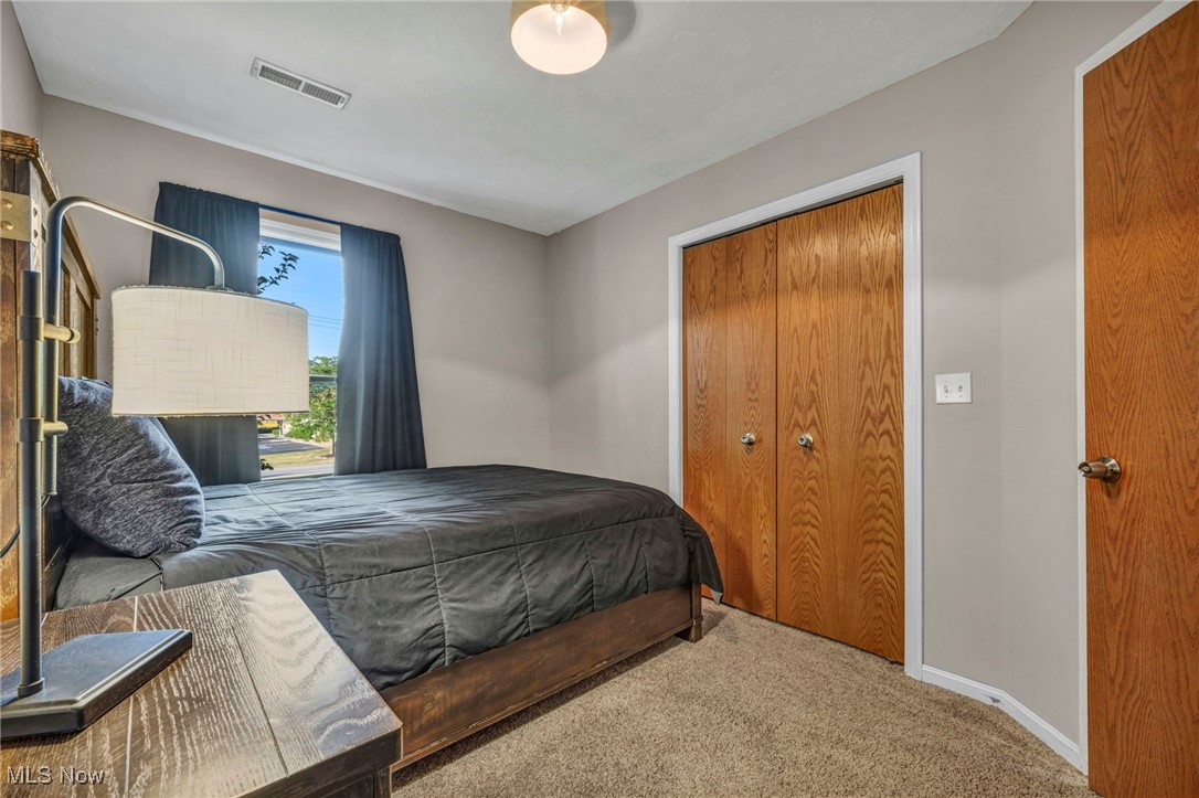 14902 Kneisel Road Vermilion, OH 44089 - Photo 30 of 49 Carpeted bedroom with a closet