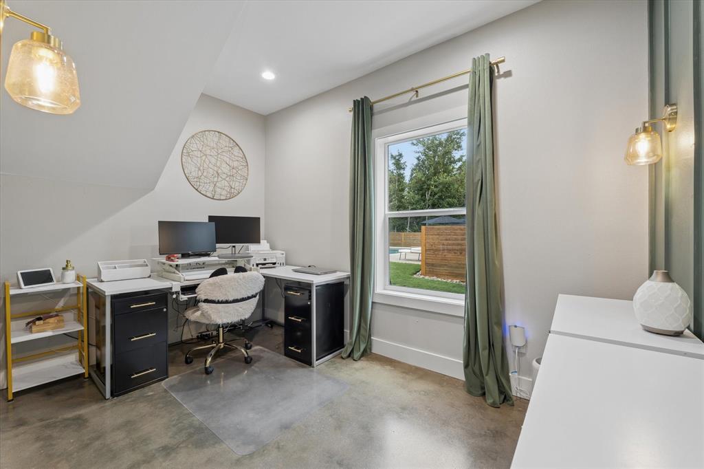 286 Benevolence Way China Spring, TX 76633 - Photo 16 of 37 Versatile interior space featuring polished concrete flooring, a double-hung window with exterior landscape, built-in recessed lighting, and wall-mounted sconces
