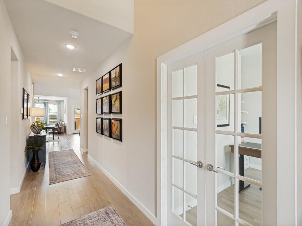10613 Smiths Bnd Road Fort Worth, TX 76126 - Photo 2 of 29 Hallway featuring recessed lighting, wood-finish flooring, and crisp white baseboards