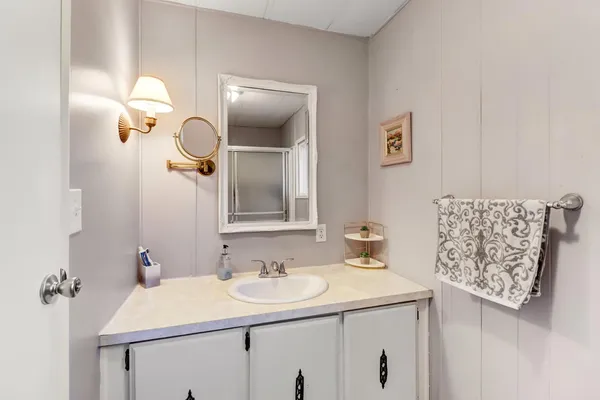 a bathroom with a sink and a mirror