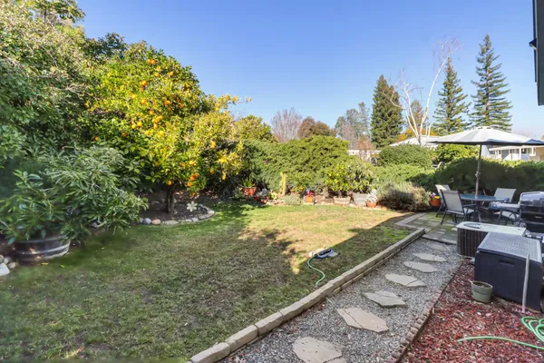 a view of a backyard with sitting area