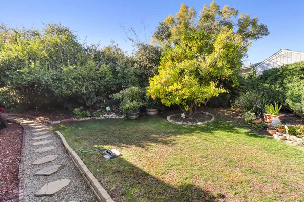 a view of a backyard with swimming pool