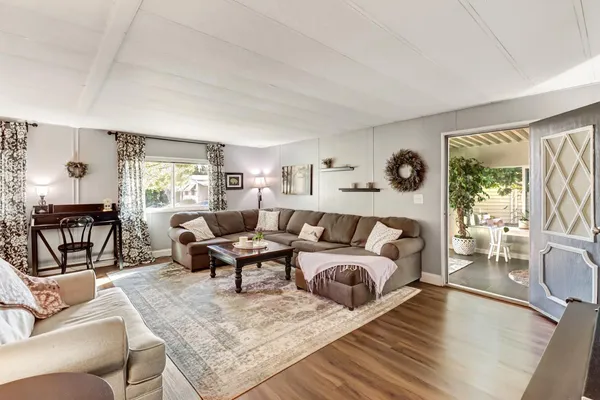 a living room with furniture and a table