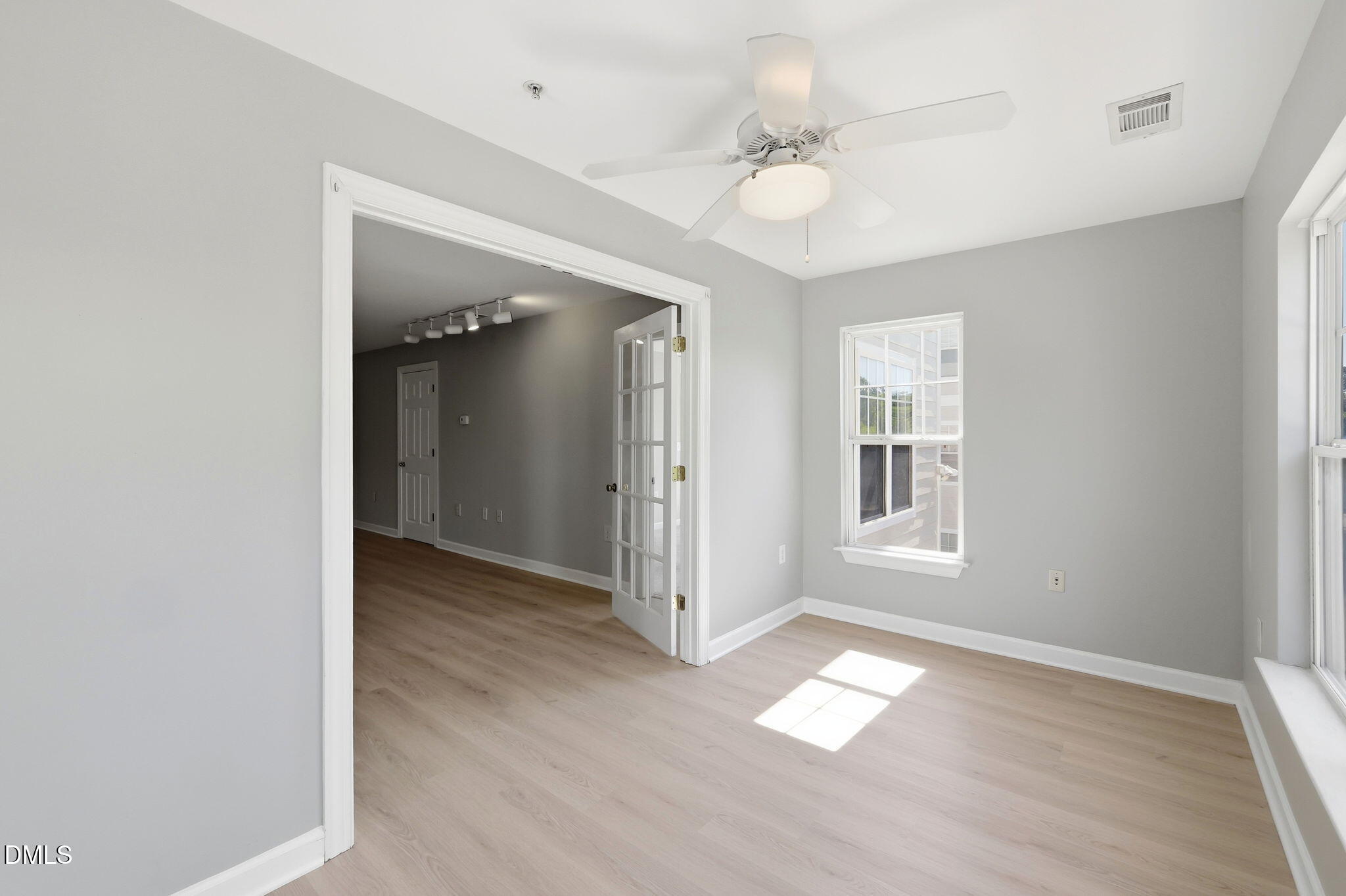 929 Morreene Road, Unit A23 Durham, NC 27705 - Photo 14 of 41 wooden floor in an empty room with a window