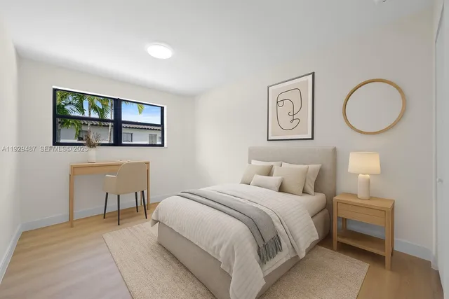 a bedroom with a bed and a table