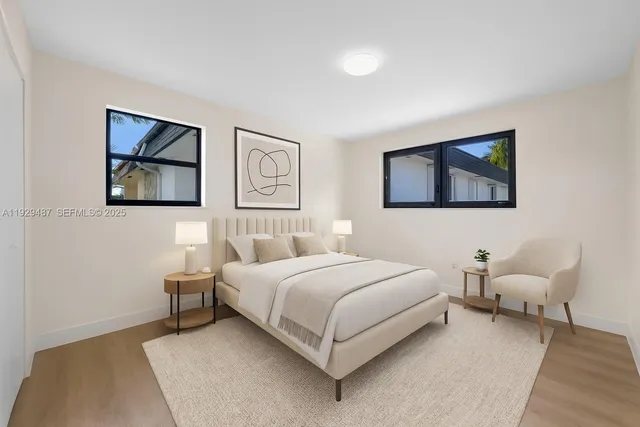 a bedroom with a bed and a couch