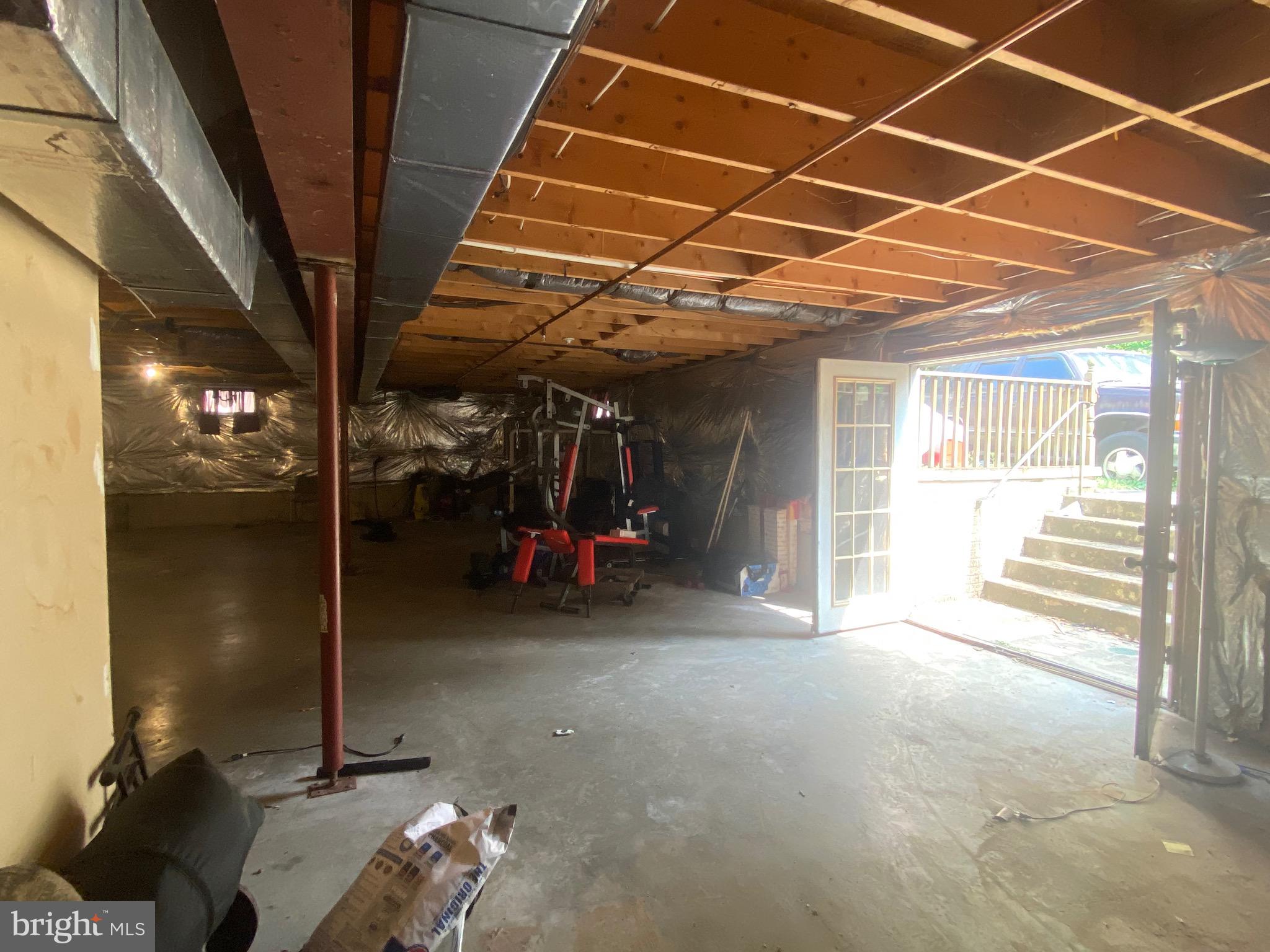 6701 Springbrook Lane Clinton, MD 20735 - Photo 39 of 53 unfinished basement walkout to backyard