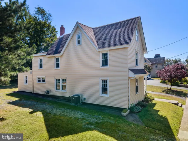 a front view of a house with a swimming pool