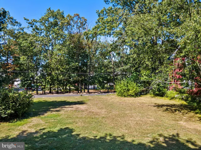 a view of outdoor space with deck and yard