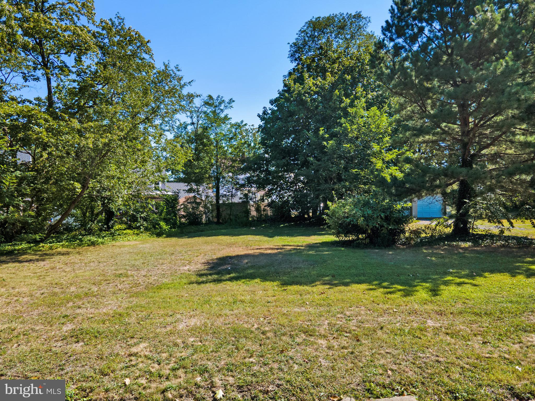 349 West Jersey Avenue Pitman, NJ 08071 - Photo 25 of 66 a view of a swimming pool with a yard and large trees