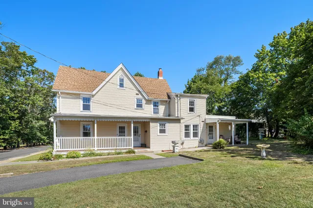 a view of a yard with swimming pool