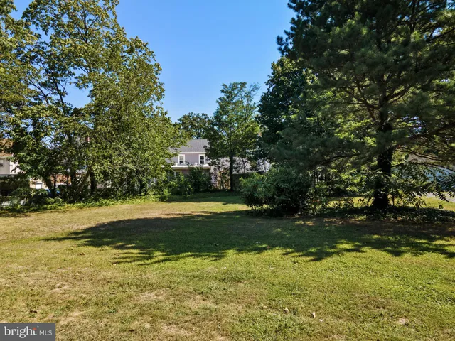 a view of outdoor space with deck and yard