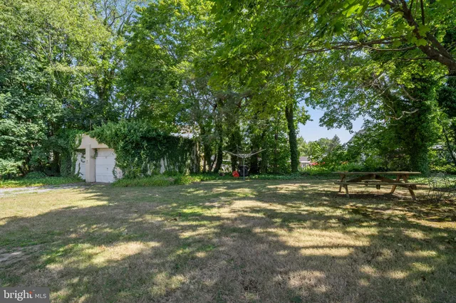 a kitchen with a stove a sink and a refrigerator