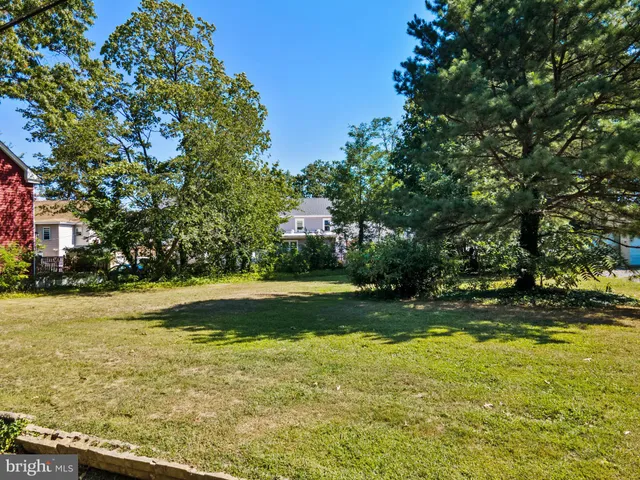 a kitchen with a refrigerator and a sink