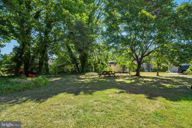 a kitchen with a refrigerator and a stove top oven