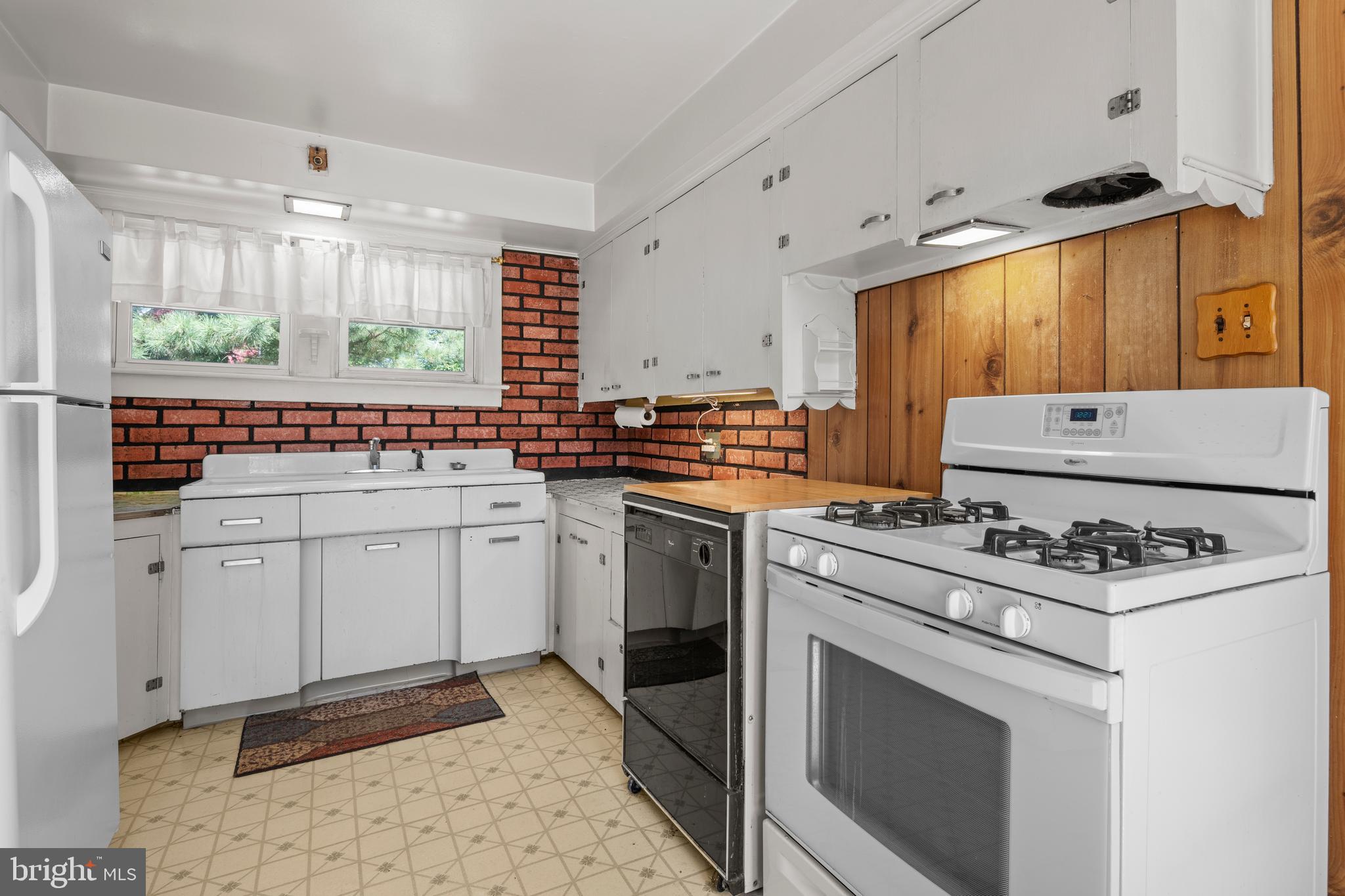 349 West Jersey Avenue Pitman, NJ 08071 - Photo 40 of 66 a kitchen with a stove a sink and a refrigerator