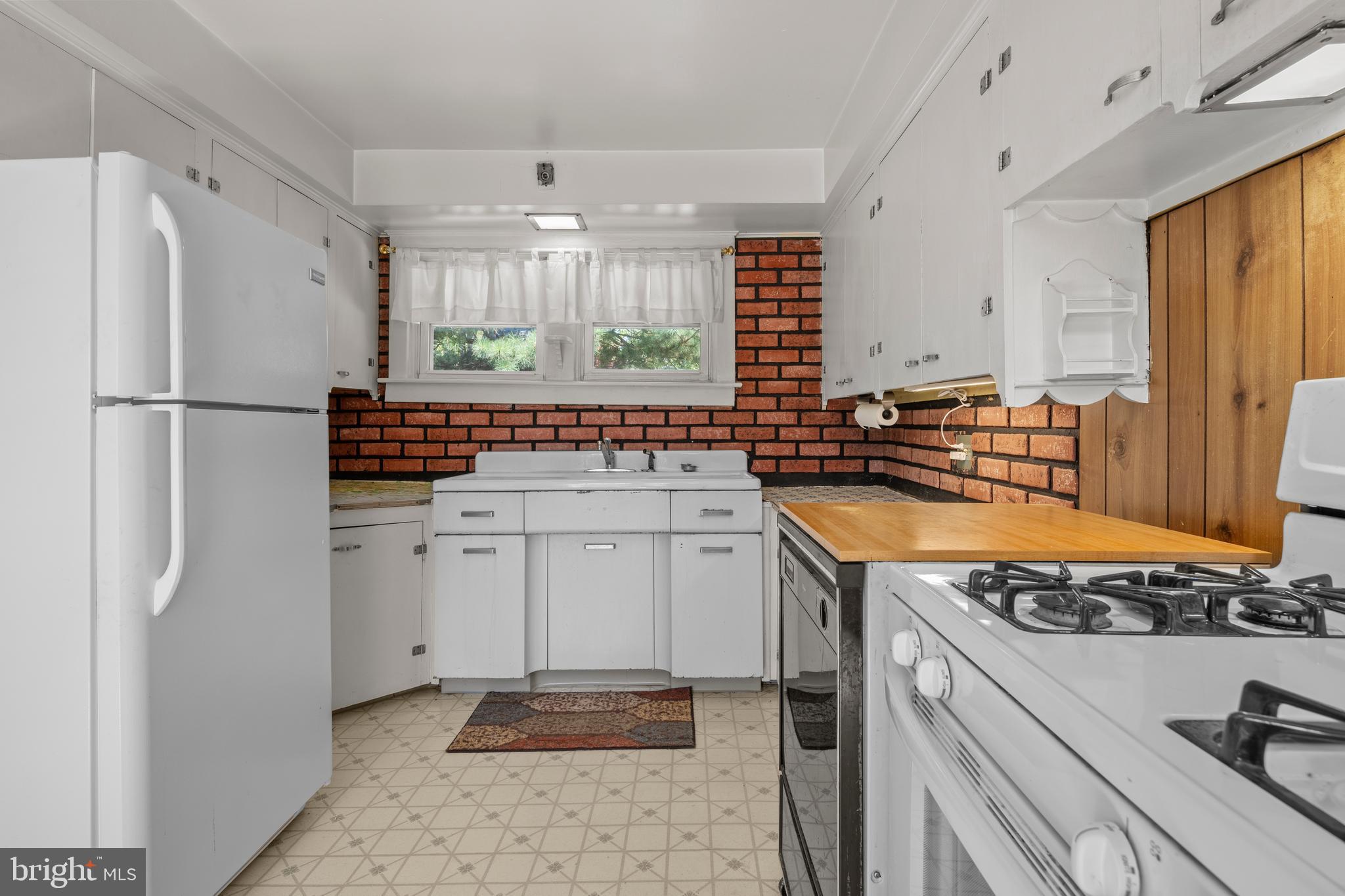 349 West Jersey Avenue Pitman, NJ 08071 - Photo 41 of 66 a kitchen with a refrigerator and a sink