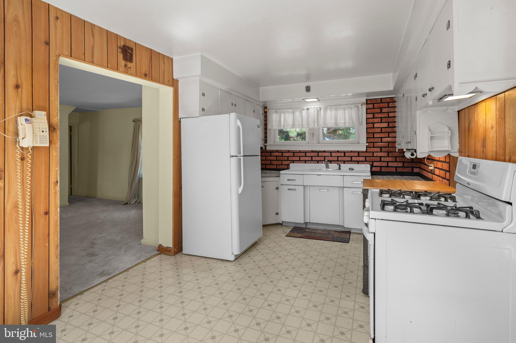 349 West Jersey Avenue Pitman, NJ 08071 - Photo 42 of 66 a kitchen with a refrigerator and a stove top oven