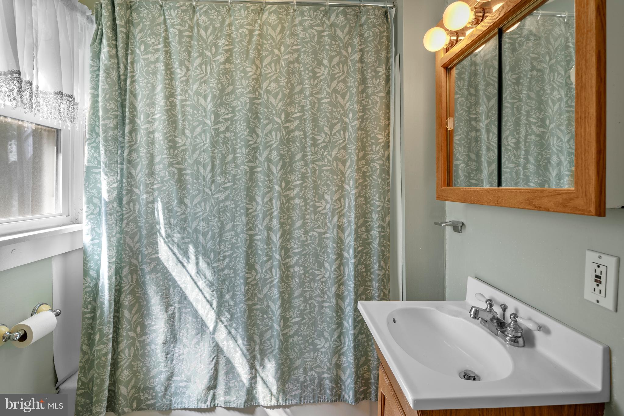 349 West Jersey Avenue Pitman, NJ 08071 - Photo 43 of 66 a bathroom with a sink a toilet and a mirror