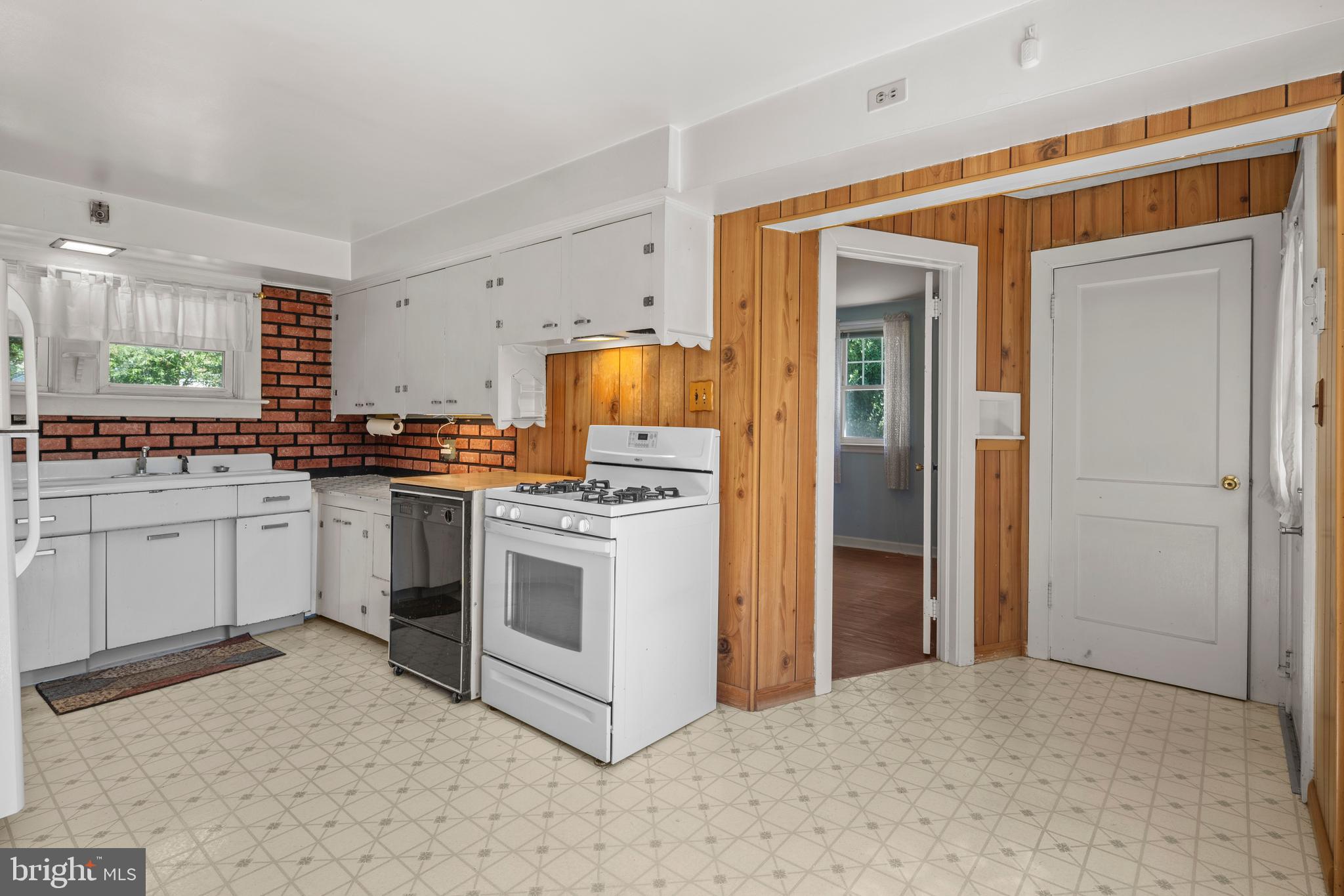 349 West Jersey Avenue Pitman, NJ 08071 - Photo 44 of 66 a kitchen with white cabinets and stainless steel appliances
