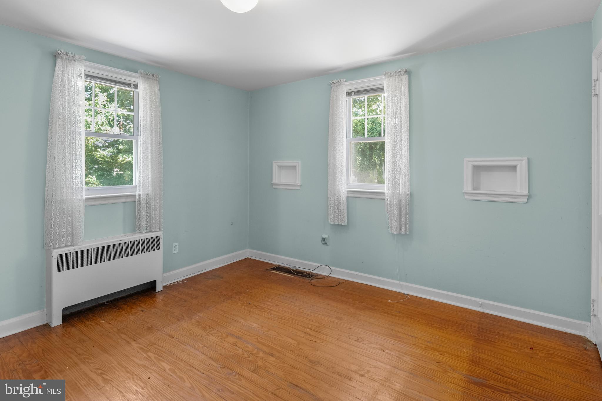 349 West Jersey Avenue Pitman, NJ 08071 - Photo 45 of 66 a view of a room with wooden floor and windows