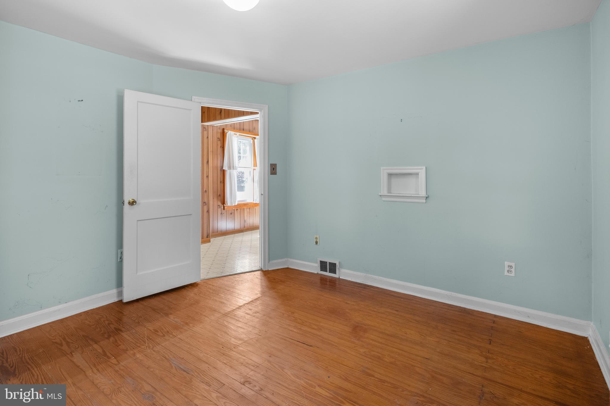 349 West Jersey Avenue Pitman, NJ 08071 - Photo 46 of 66 an empty room with wooden floor and windows