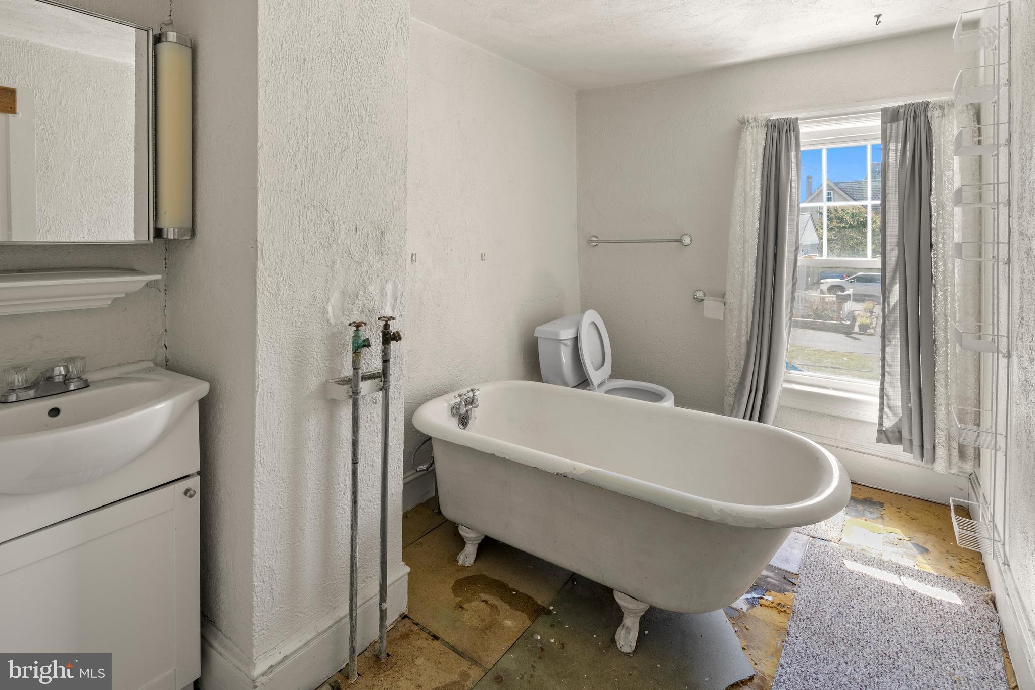 349 West Jersey Avenue Pitman, NJ 08071 - Photo 58 of 66 a bathroom with a sink and mirror