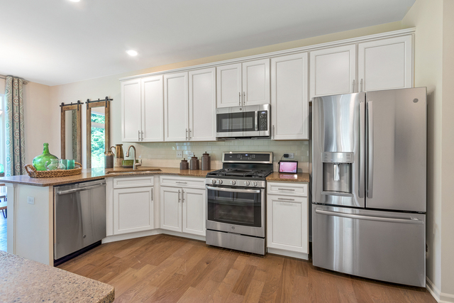 2009 Stuttle Road Batavia, IL 60510 - Photo 10 of 27 a kitchen with stainless steel appliances white cabinets and a refrigerator