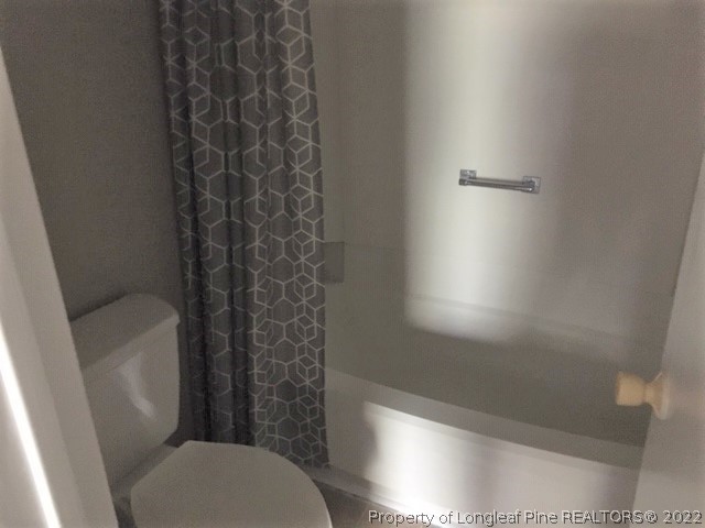 3319 Arrowhead Road Spring Lake, NC 28390 - Photo 14 of 20 a bathroom with a toilet and shower