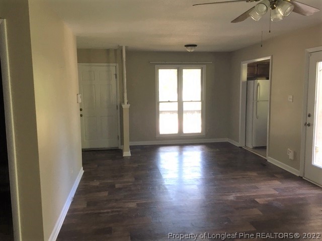 3319 Arrowhead Road Spring Lake, NC 28390 - Photo 6 of 20 an empty room with wooden floor and windows