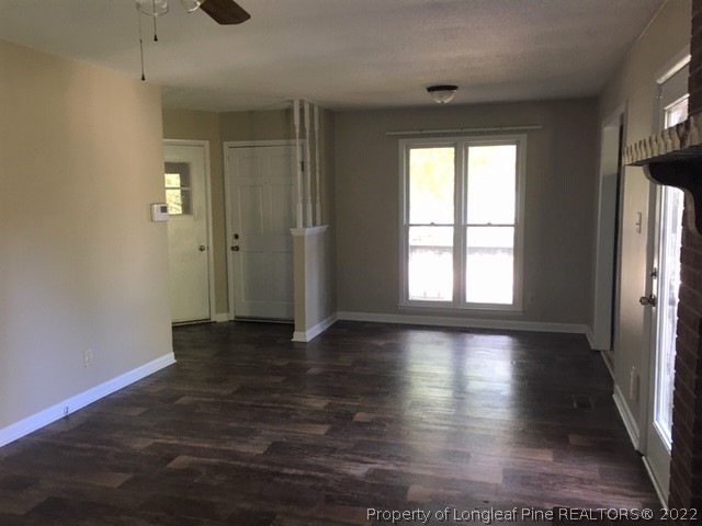 3319 Arrowhead Road Spring Lake, NC 28390 - Photo 7 of 20 wooden floor in an empty room with a window