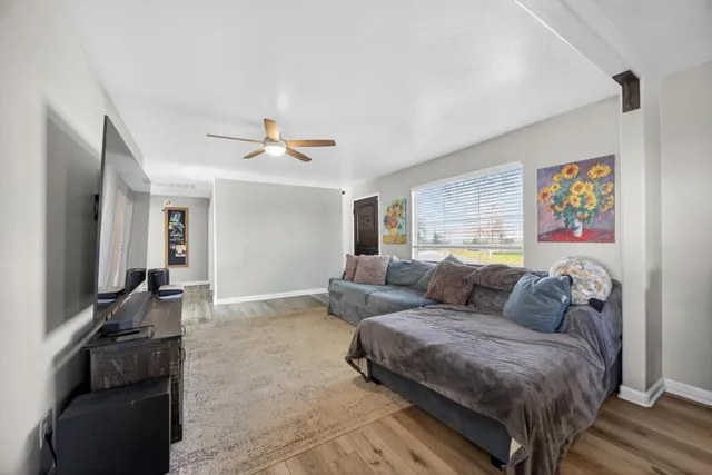 a kitchen with a table chairs and refrigerator