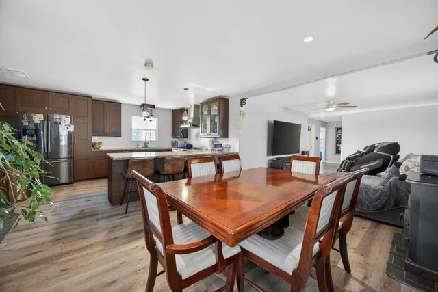 a view of a livingroom with furniture and a flat screen tv