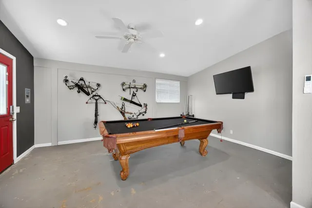 a view of a swimming pool with a yard