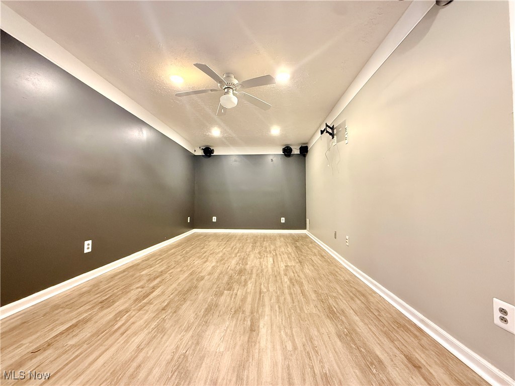 155 Stone Ridge Way Berea, OH 44017 - Photo 28 of 32 Unfurnished room with ceiling fan, light wood-style flooring, baseboards, recessed lighting, and a textured ceiling