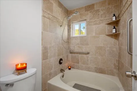 a bathroom with a tub a sink and a shower
