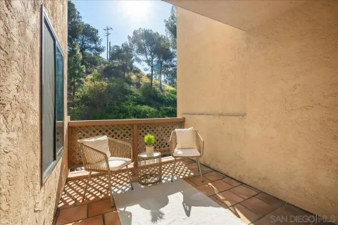 a view of a balcony with wooden floor
