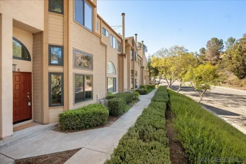a view of a building next to a yard