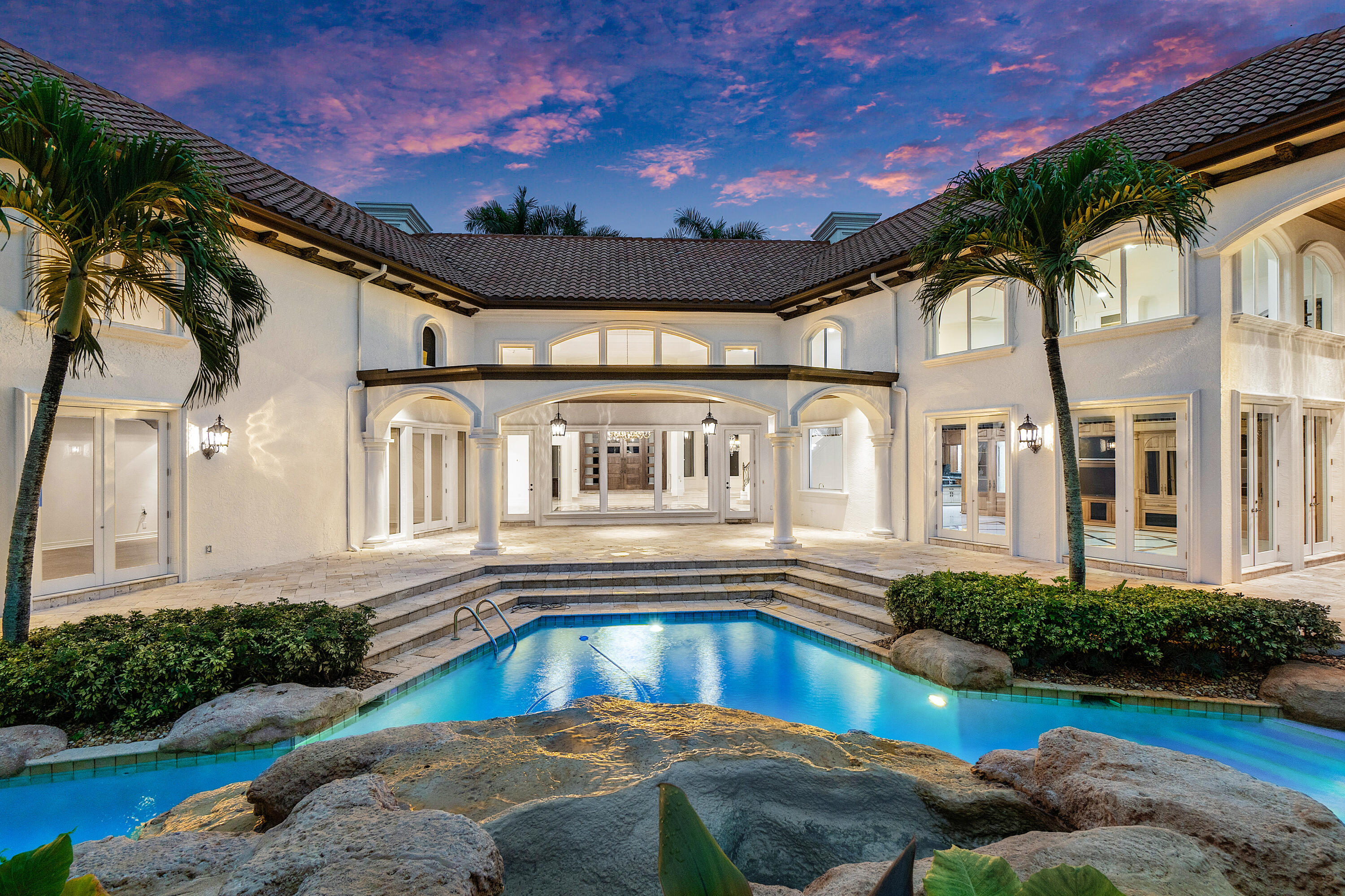 17951 Lake Estates Drive Boca Raton, FL 33496 - Photo 42 of 105 twilight pool/back of house