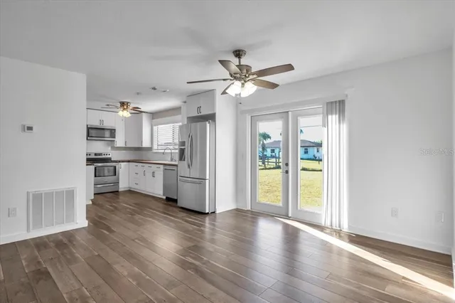 a view of a kitchen with a sink and a window