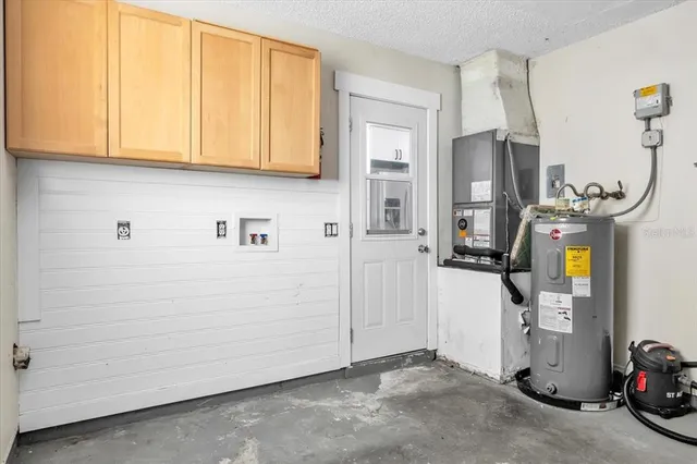a view of a storage & utility room with two washing machine