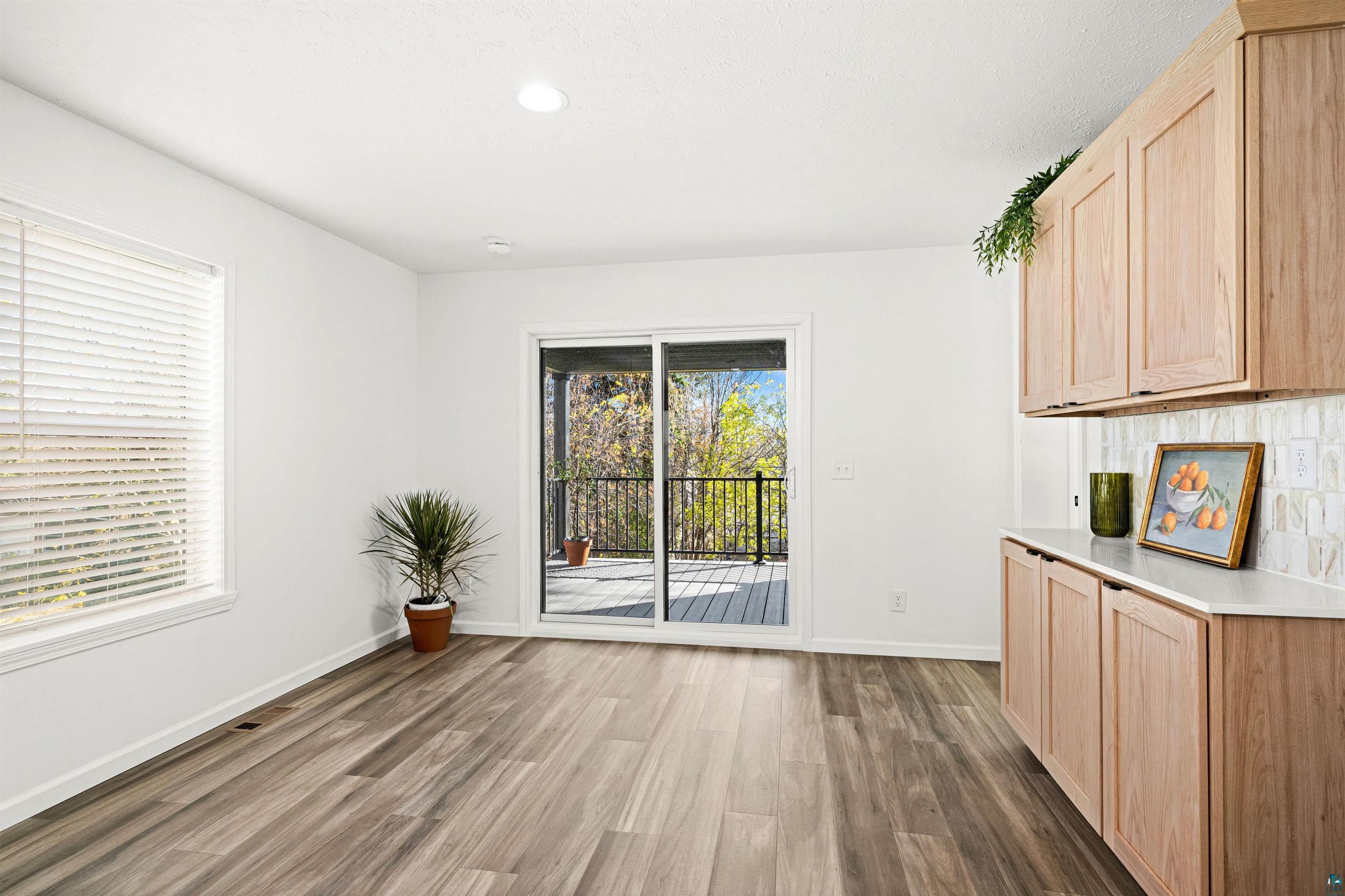 1914 East 1st Street Duluth, MN 55812 - Photo 17 of 26 Dining area w/access to beautifully designed covered deck viewing rear yard.
