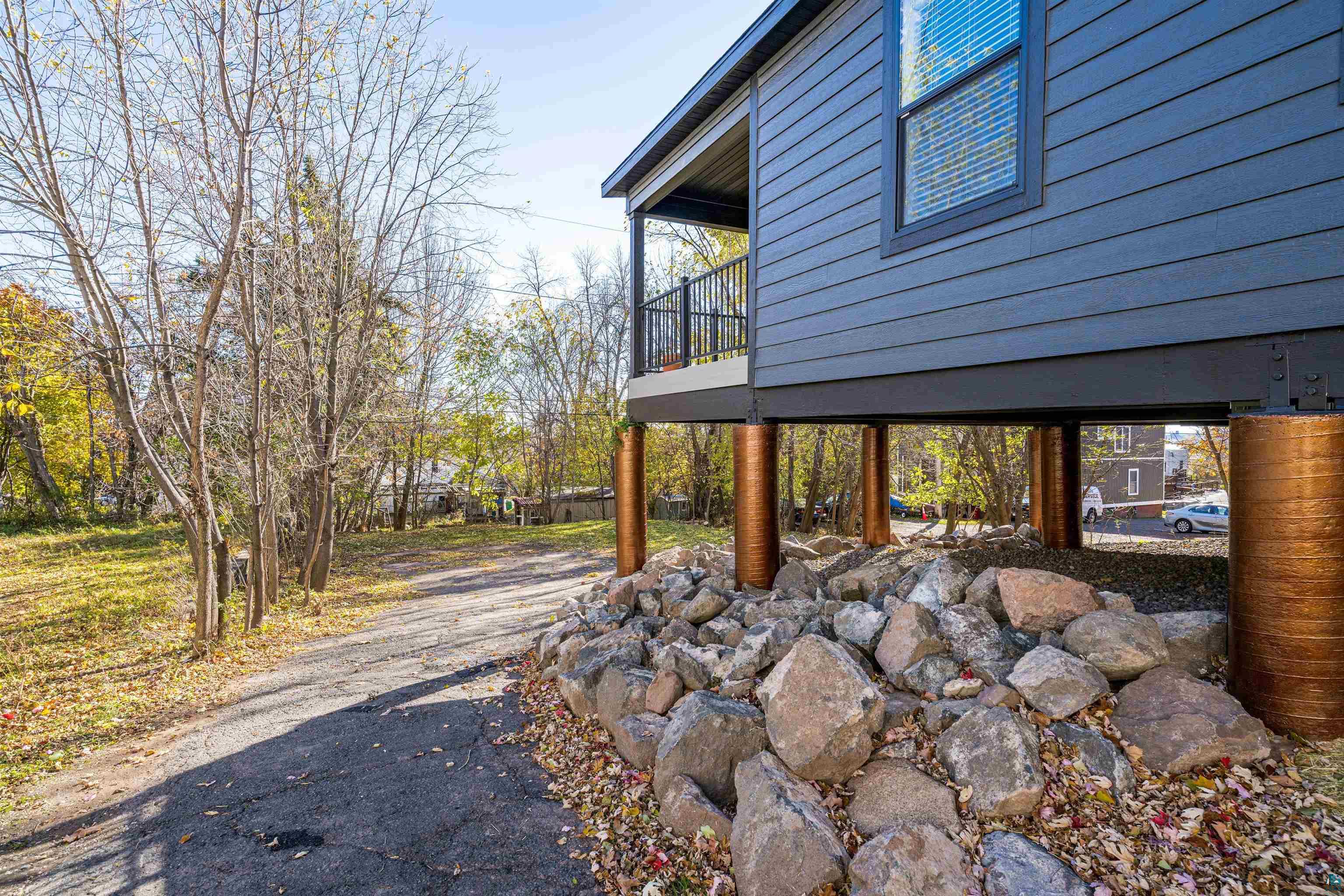 1914 East 1st Street Duluth, MN 55812 - Photo 4 of 26 View of side of home featuring Structural view & rear covered deck viewing back yard.