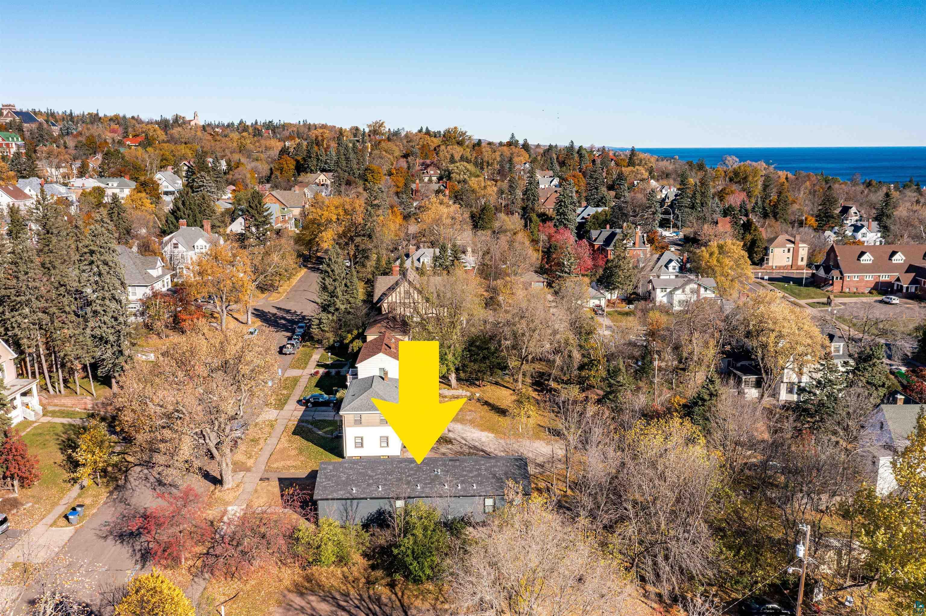 1914 East 1st Street Duluth, MN 55812 - Photo 8 of 26 Aerial view of residential area with a tree filled landscape and a large body of water- Lake Superior!