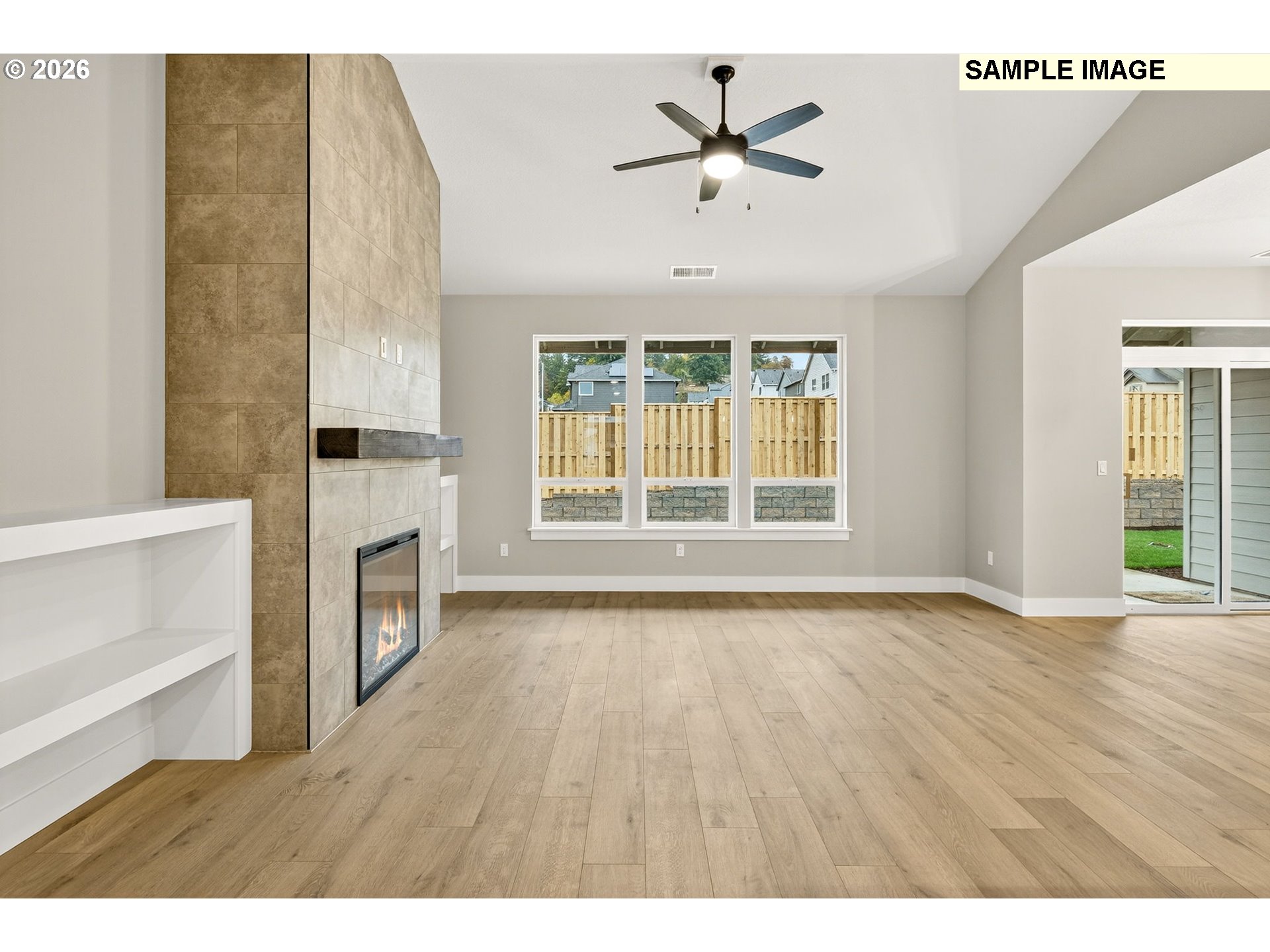 3352 Northeast Sweetwater Road, Unit 80 Estacada, OR 97023 - Photo 48 of 48 a view of an empty room with a fireplace and wooden floor