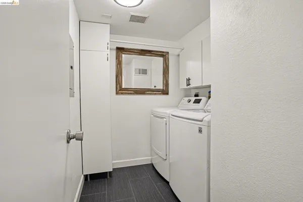 a bathroom with a sink mirror and toilet