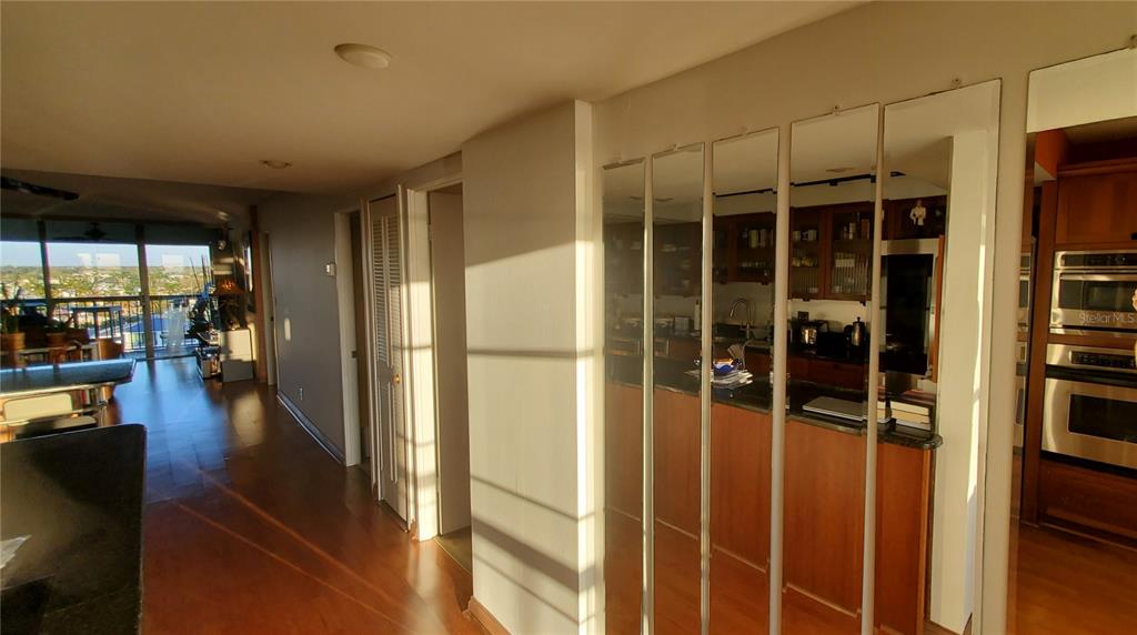 9415 Blind Pass Road, Unit 905 St. Pete Beach, FL 33706 - Photo 13 of 51 a view of a living room with a large window